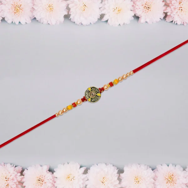 Handcrafted Om Rakhi in Antique Finish with Gold Beads & Red Thread