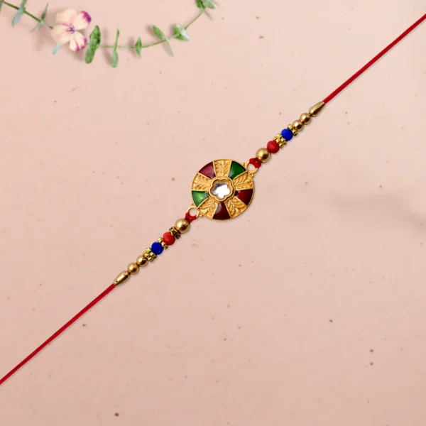 Traditional Kundan Rakhi – Multicolor Design with Golden Floral Center