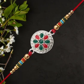 Silver Plated Flower Rakhi with Red & Green Stones for Raksha Bandhan
