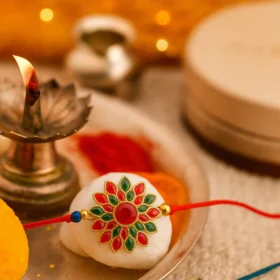 Radiant Floral Rakhi with Multicolor Stone Work