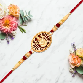 Buy Traditional Ganesha Rakhi for Brother – Golden Finish & Sacred Red Thread