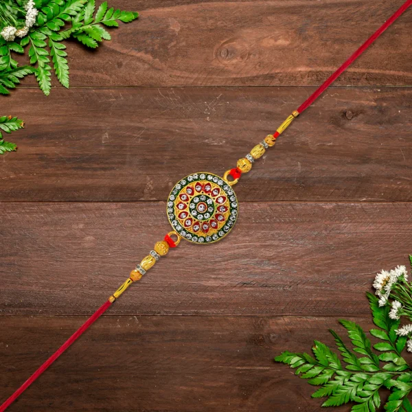 Royal Touch – Kundan Rakhi with Red & Green Enamel and Gold Beads