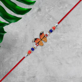 Butterfly Rakhi with Colorful Beads and Red Mauli Thread – A Joyful Festive Choice