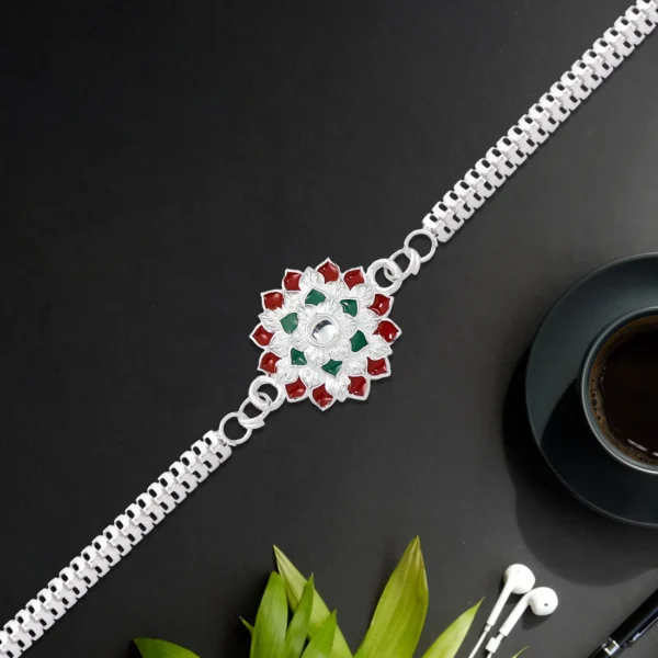 Stylish Round Silver Rakhi with Red-Green Accents on Designer Chain