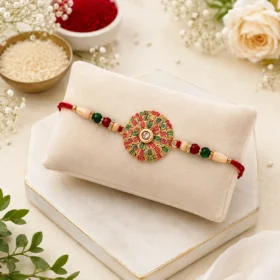 Traditional Kundan Rakhi with Golden Floral Base and Decorative Beads
