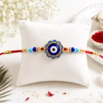 Evil Eye Rakhi with Blue Beads and Golden Accents – Protective Nazar Design with Roli & Chawal