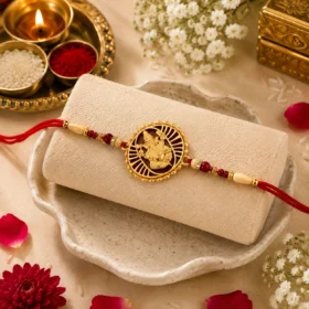 Traditional Ganesha Rakhi with Golden Finish and Sacred Red Thread | Raksha Bandhan Rakhi with Roli Chawal