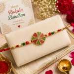 Traditional Rakhi with Bright Floral Centerpiece and Decorative Thread