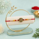 Traditional Antique Finish Rakhi Om Rakhi with Golden Beads and Red Thread
